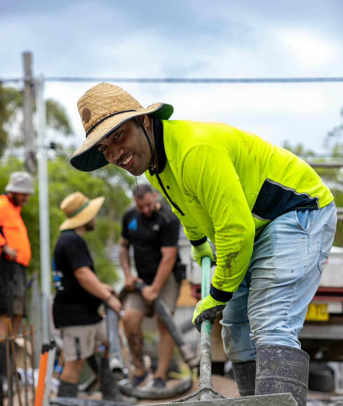 A tradesperson finishing a concrete slab on site